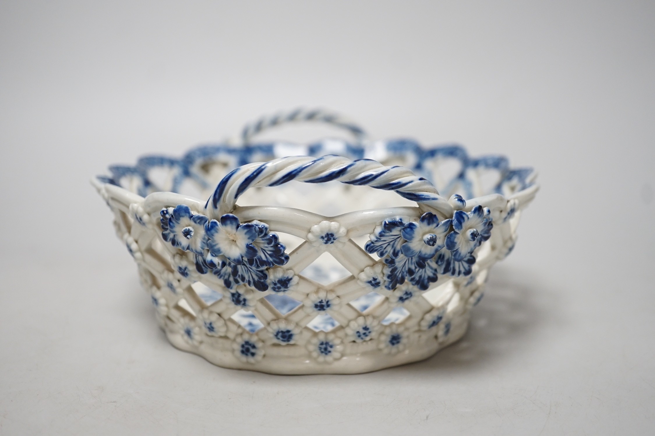 An 18th century Caughley basket printed with fir cones, under a painted border, C mark and very rare IT moulded mark, verso, Ex-Godden Reference Collection, 22cms wide